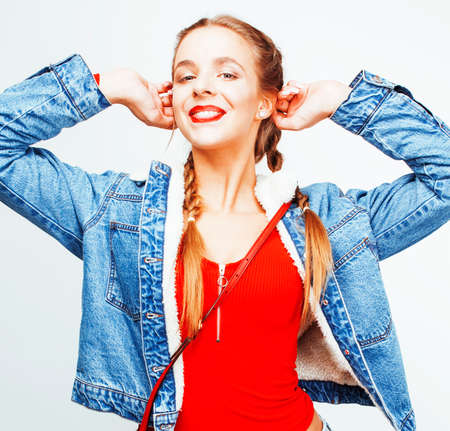 young pretty stylish blond hipster girl posing emotional isolated on white background happy smiling...
