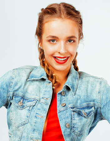 young pretty stylish blond hipster girl posing emotional isolated on white background happy smiling...