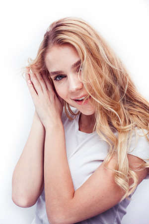 young pretty stylish blond hipster girl posing emotional isolated on white background happy smiling cool smile, lifestyle people conceptの写真素材