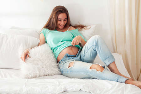 young pretty caucasian woman posing cheerful in bed, lifestyle people concept