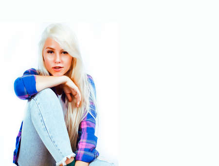 young pretty teenage hipster girl posing emotional happy smiling on white background, lifestyle people conceptの写真素材