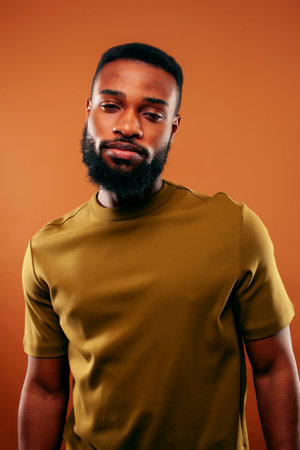 young pretty african american man posing cheerful on brown background, lifestyle people concept