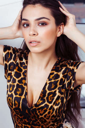 pretty stylish woman in fashion dress with in luxury rich room interior, lifestyle people concept, modern brunetteの写真素材