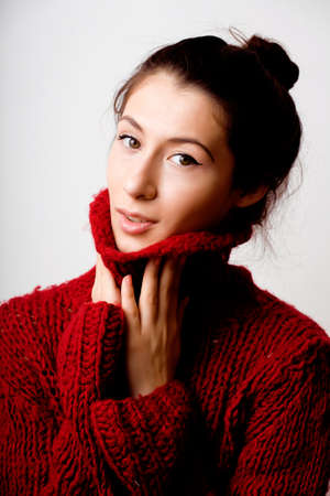 young pretty woman in sweater and scarf all over her face, lifestyle people winter conceptの写真素材