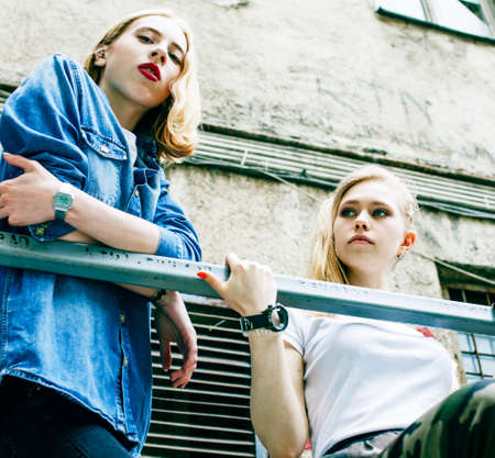 couple of teenage girls ouyside on streets chilling, lifestyle people conceptの写真素材