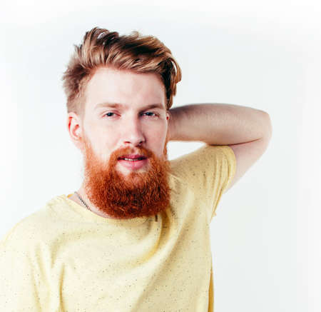 young handsome hipster ginger bearded guy looking brutal isolated on white background, lifestyle...