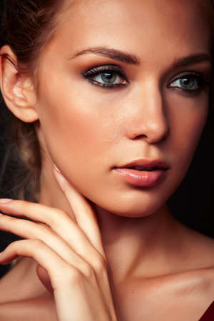 young sensual blond woman posing on black background, lifestyle people conceptの写真素材