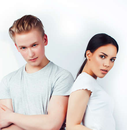 modern hipster guys together couple diverse nations, asian girl and caucasian blond boy isolated on white background, lifestyle people conceptの写真素材