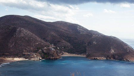 Beautiful greek landscape: seashore with mountains and cloudsの写真素材