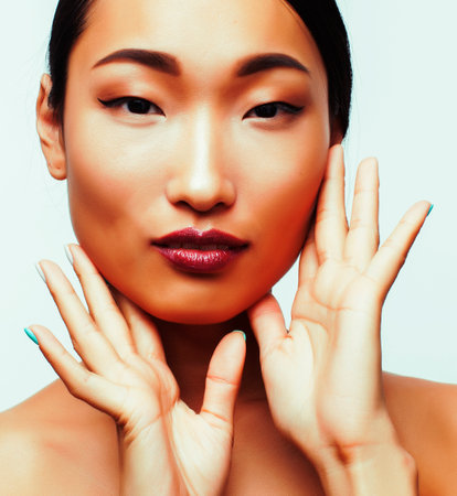 young pretty asian woman close up isolated on white background, spa womans day conceptの写真素材
