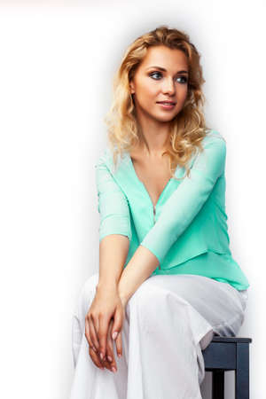 young pretty stylish blond girl posing emotional isolated on white background happy smiling cool smile, lifestyle people conceptの写真素材