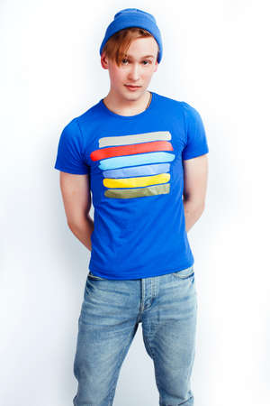 young handsome teenage hipster guy posing emotional, happy smiling against white background isolated, lifestyle people conceptの写真素材