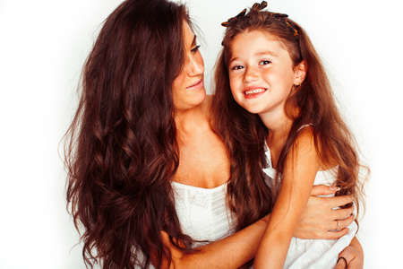 bright picture of hugging mother and daughter happy together, smiling stylish family. lifestyle people conceptの写真素材