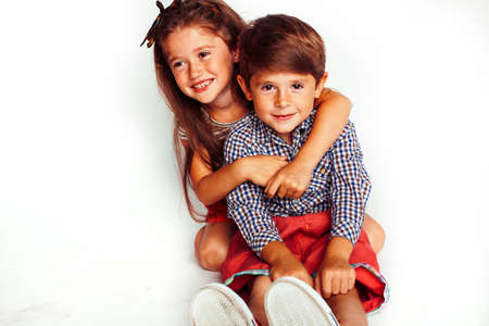 little cute boy and girl hugging playing on white background, happy smiling family, lifestyle people...