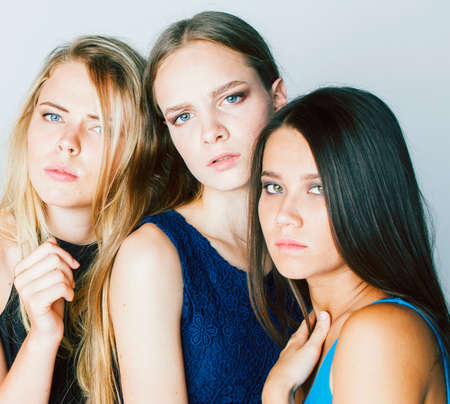 group of many cool modern girls friends in bright clothers together having fun isolated on white background, happy smiling lifestyle people conceptの写真素材