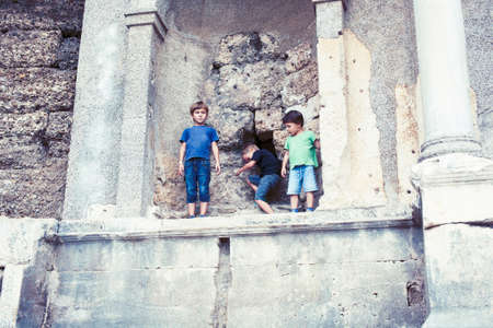 little boy exploring ancient architecture, lifestyle people on summer vacationの写真素材