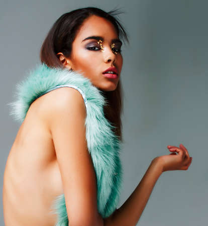 young pretty african-american woman posing in fashion clothers emotional, lifestyle people conceptの写真素材