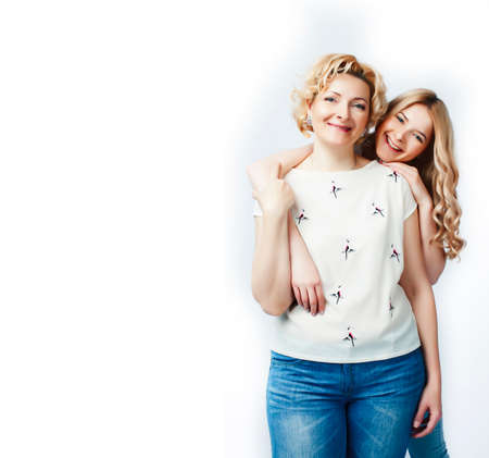 mother with daughter together posing happy smiling isolated on white background with copyspace, lifestyle people conceptの写真素材