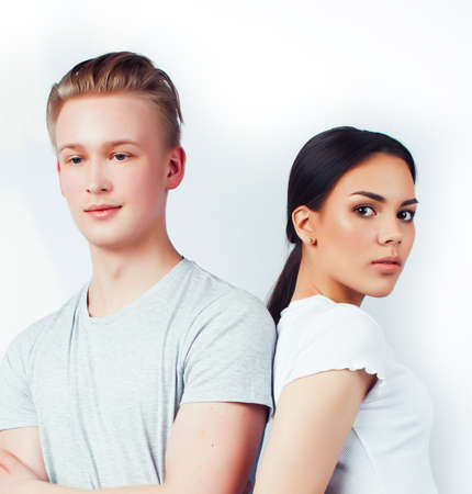 modern hipster guys together couple diverse nations, asian girl and caucasian blond boy isolated on white background, lifestyle people conceptの写真素材