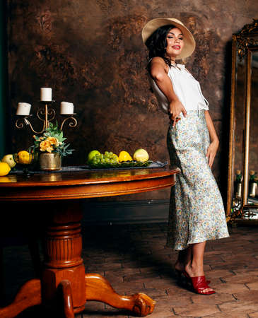 young pretty rich italian woman in golden luxury room interior, elegant styled hotel, people on vacationの写真素材