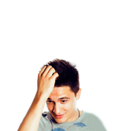 young attractive man isolated thinking emotional on white closeup gesturing smiling, lifestyle people conceptの写真素材