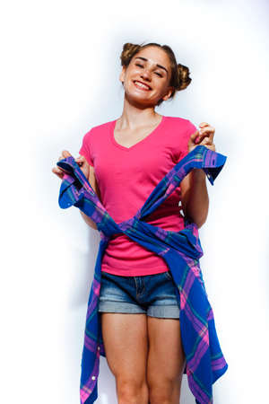 young pretty teenage hipster girl posing emotional happy smiling on white background, lifestyle people conceptの写真素材