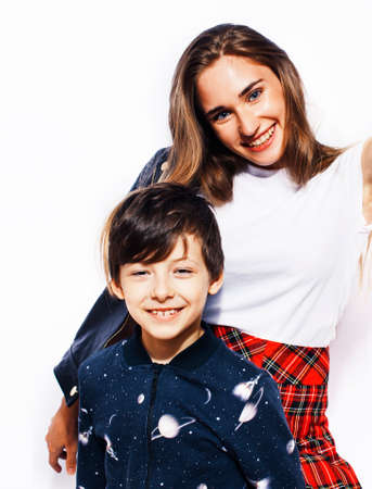 lifestyle and people concept, little cute boy with teenage girl posing together cheerful happy smiling isolated on white backgroundの写真素材