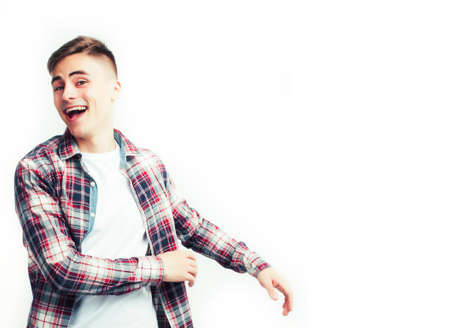 young handsome teenage hipster guy posing emotional, happy smiling against white background isolated, lifestyle people conceptの写真素材