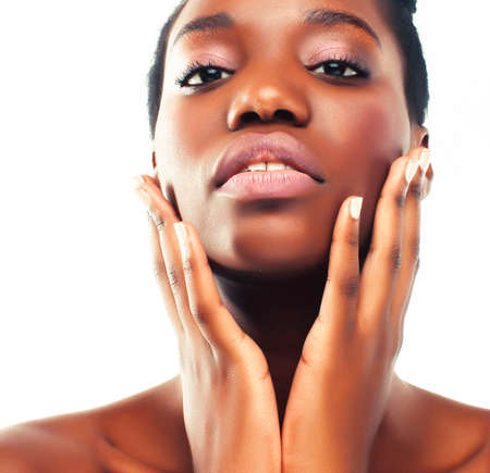 young pretty african american woman naked taking care of her skin isolated on white background, healthcare people conceptの写真素材