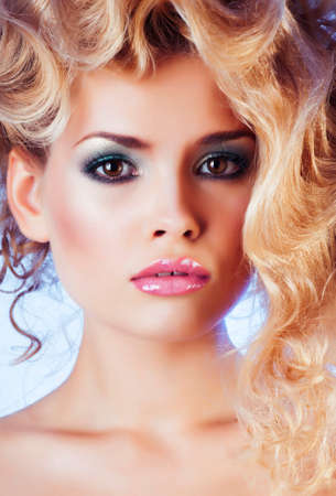 beauty blond woman with curly hair close up isolated, fashion makeup and styleの写真素材