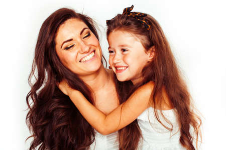 bright picture of hugging mother and daughter happy together, smiling stylish family. lifestyle people conceptの写真素材