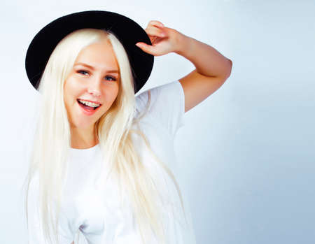 young pretty stylish blond hipster girl in hat posing emotional isolated on white background, lifestyle people conceptの写真素材
