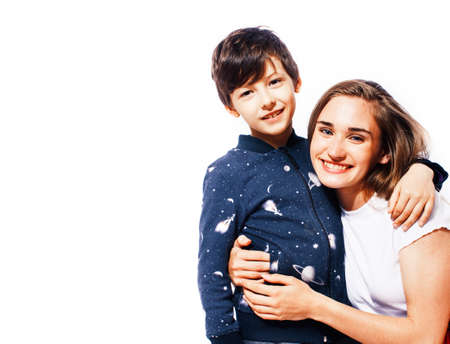 lifestyle and people concept, little cute boy with teenage girl posing together cheerful happy smiling isolated on white backgroundの写真素材