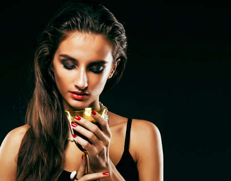 beauty rich woman with bright makeup wearing luxury jewellery on black background, fashion ladyの写真素材