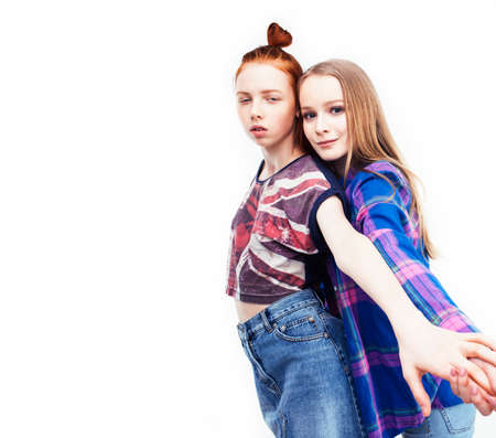 best friends teenage girls together having fun, posing emotional on white background, besties happy smiling, lifestyle people conceptの写真素材