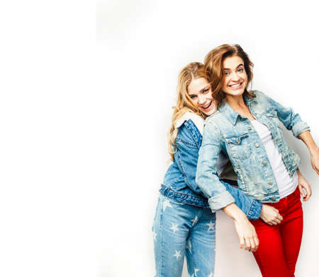 best friends teenage girls together having fun, posing emotional on white background, besties happy smiling, lifestyle people conceptの写真素材
