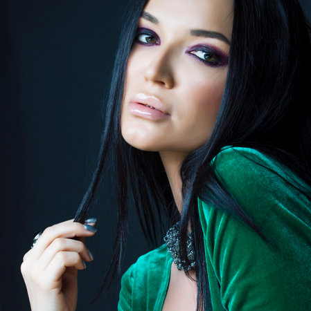 beauty rich woman with bright makeup wearing luxury jewellery on black background, fashion ladyの写真素材