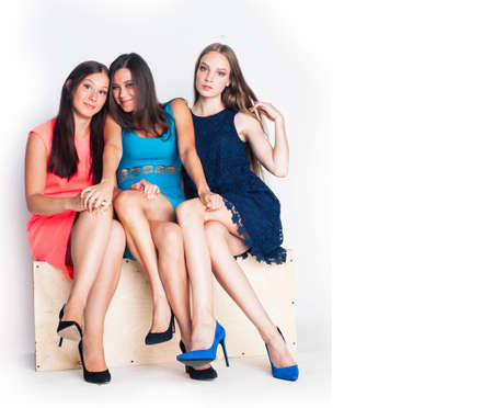 group of many cool modern girls friends in bright clothers together having fun isolated on white background, happy smiling lifestyle people conceptの写真素材