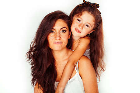 bright picture of hugging mother and daughter happy together, smiling stylish family. lifestyle people conceptの写真素材