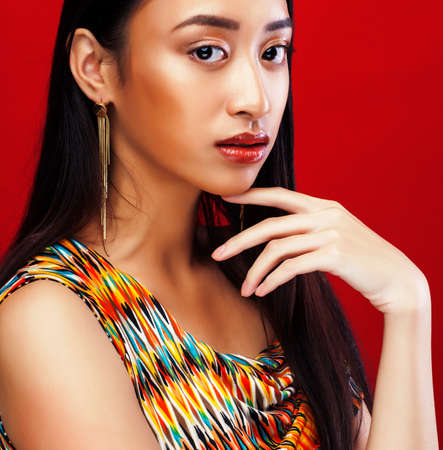 beauty young asian girl with fashion make up on red background , beauty stylish lookの写真素材