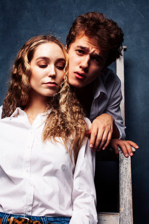 young pretty boy and girl friends happy smiling together in interior, emotional couple, lifestyle people conceptの写真素材
