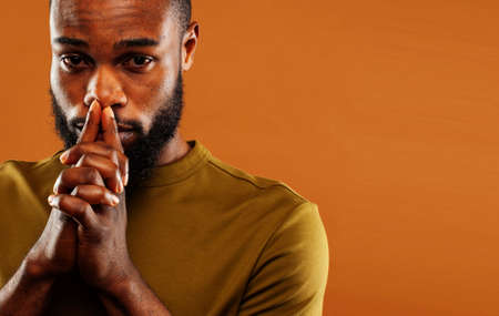 young pretty african american man posing cheerful on brown background, lifestyle people conceptの写真素材