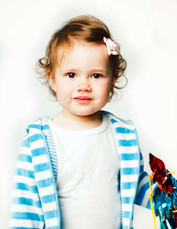 little cute daughter girl on white, happy smiling family inside isolated adorable, lifestyle modern people conceptの写真素材