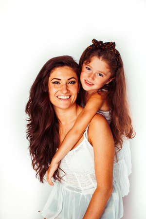 bright picture of hugging mother and daughter happy together, smiling stylish family. lifestyle people conceptの写真素材