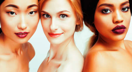 different nation woman: african-american, caucasian, asian together isolated on white background happy smiling, diverse type on skin, lifestyle people conceptの写真素材