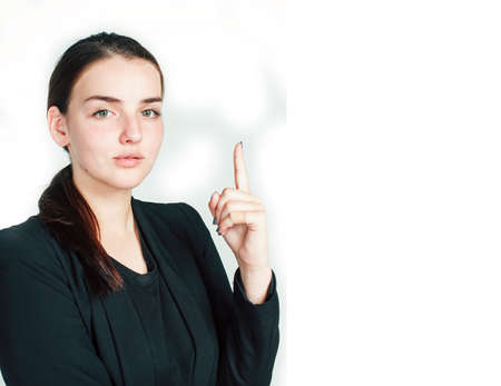 young pretty girl pointing on white background, business science people conceptの写真素材