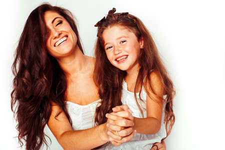 bright picture of hugging mother and daughter happy together, smiling stylish family. lifestyle people conceptの写真素材