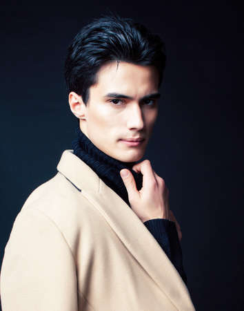 handsome asian fashion looking man posing in studio on black background, lifestyle modern people conceptの写真素材