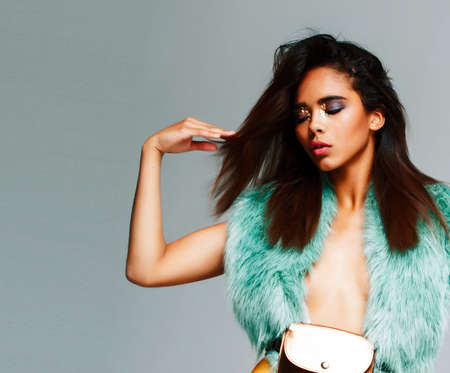 young pretty african-american woman posing in fashion clothers emotional, lifestyle people conceptの写真素材