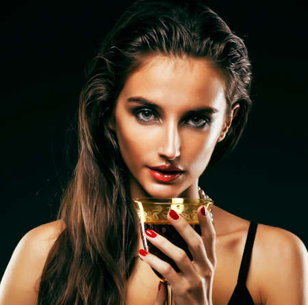 beauty rich woman with bright makeup wearing luxury jewellery on black background, fashion ladyの写真素材